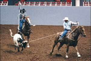 Greg and Mark roping a calf