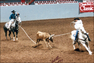 Greg and Mark roping a calf