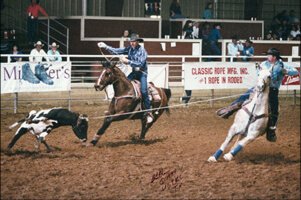 Greg and Mark roping a calf