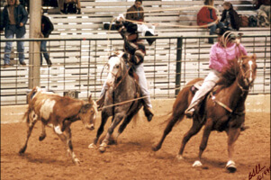 Greg and Mark roping a calf